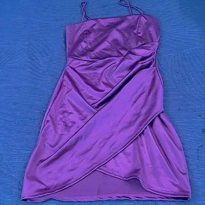 Pink dress with slit left leg. Spaghetti sting straps. Above the knee dress